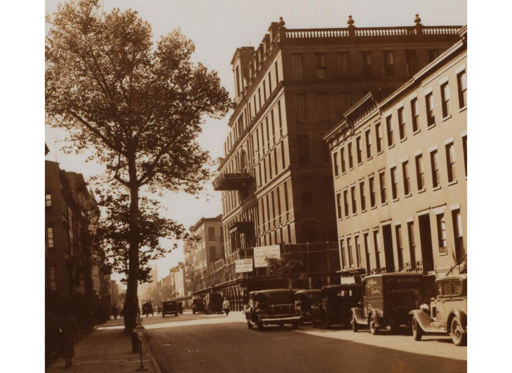 sepia colored view of clinton street with row houses