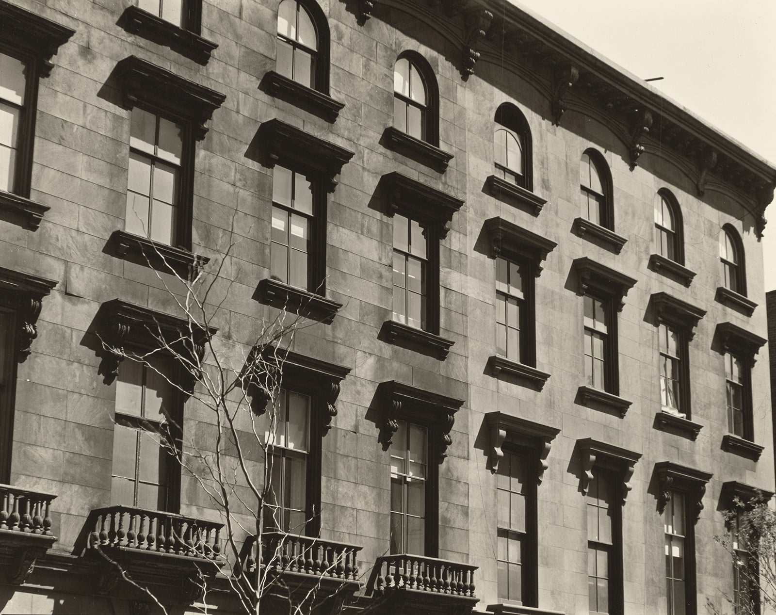 black and white photo of brownstone facades