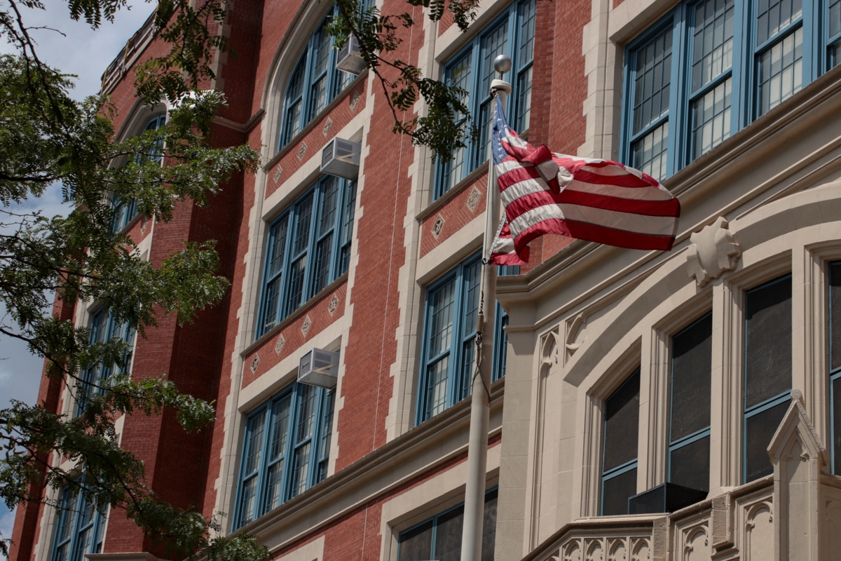 brooklyn - flag flying in front of a school in crown heights brooklyn