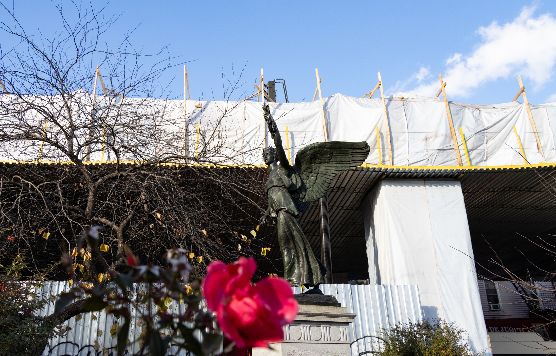 bushwick - sculpture 'Victory With Peace' and a rose still blooming