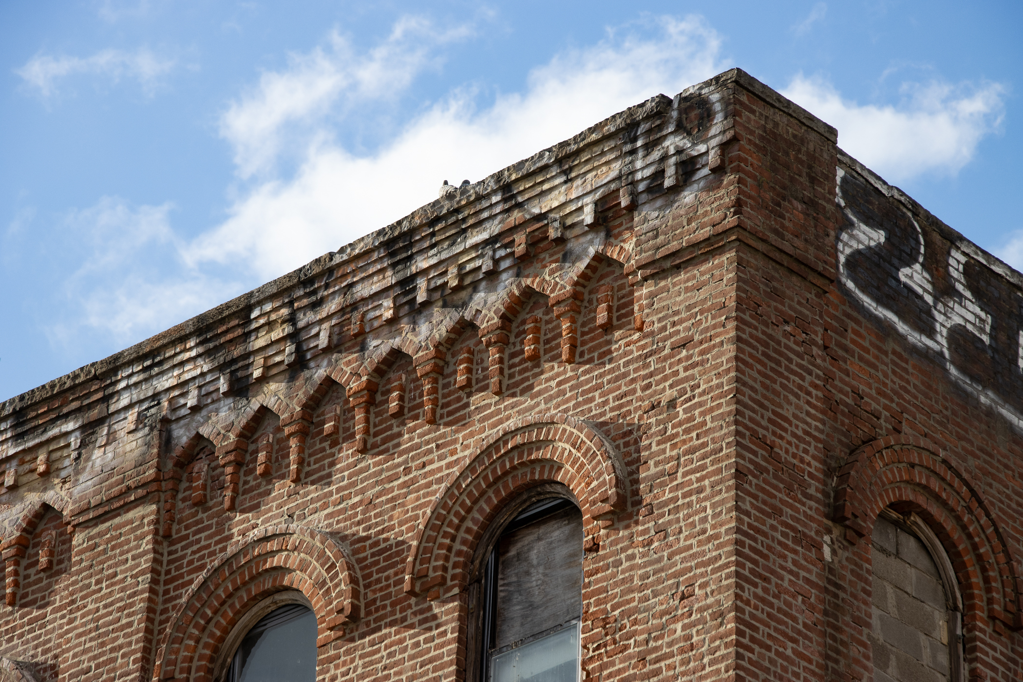 brick detailing at the top of the building