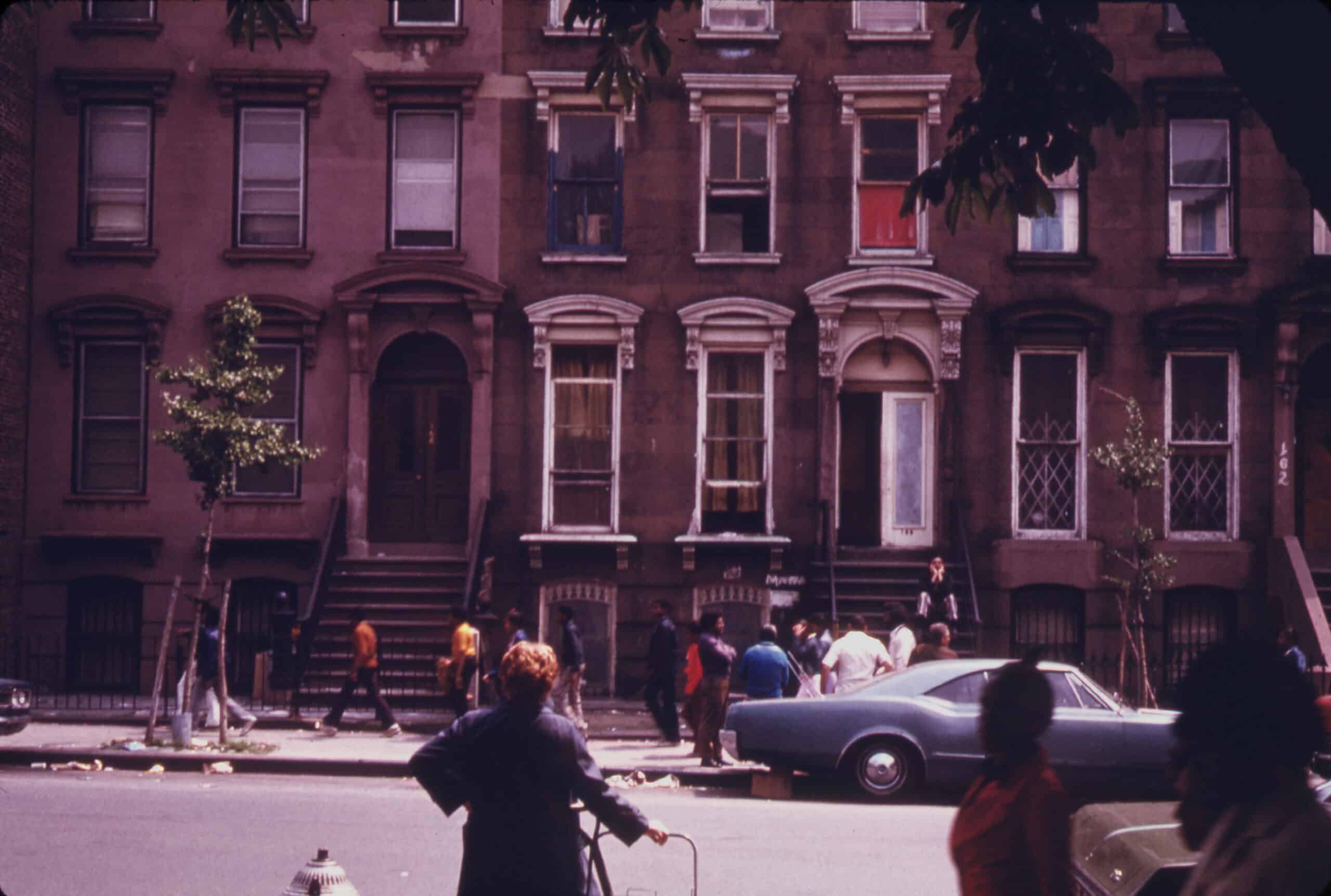 color photo of people on a fort greene street with brownstones