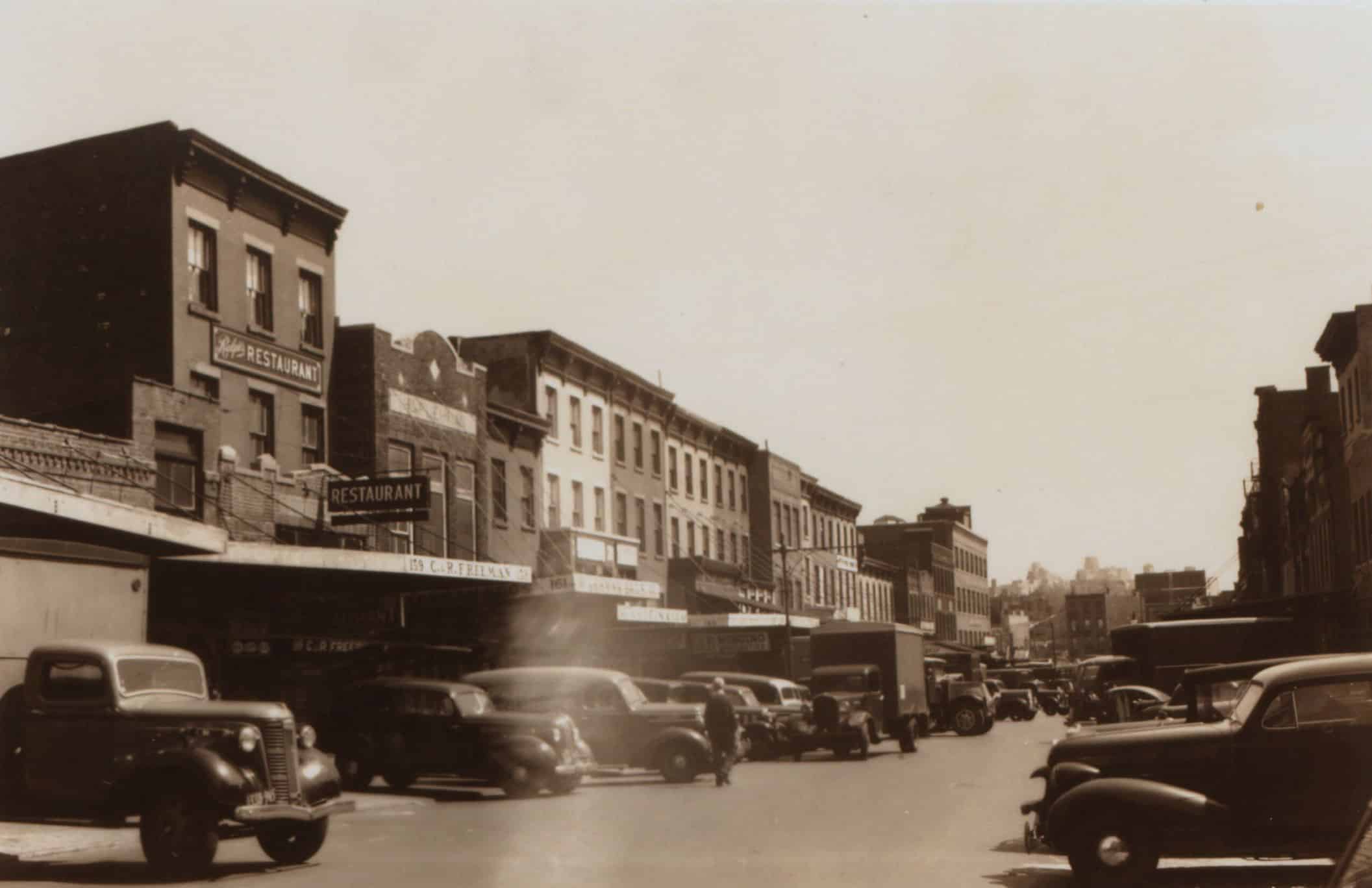 a black and white photo of market buildings