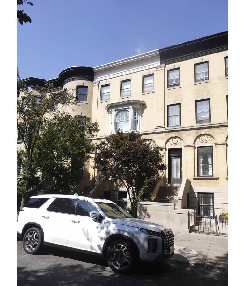 exterior view of the row house with an oriel window