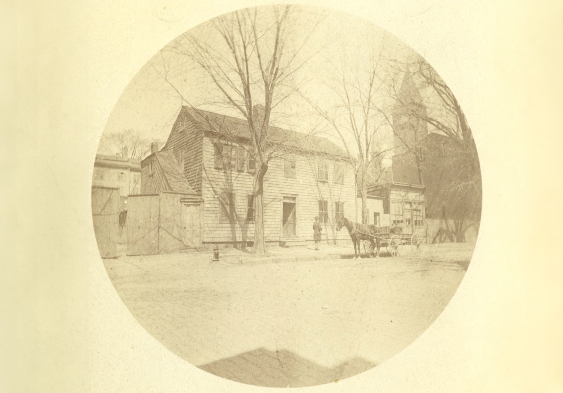 sepia toned photo of a frame house