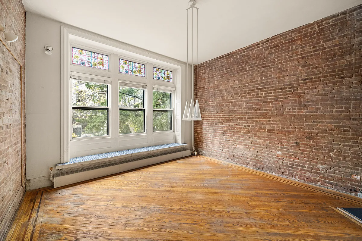 brooklyn heights - dining room with exposed brick wall