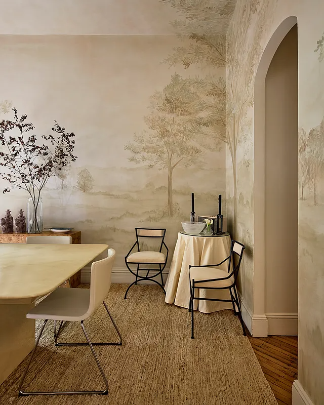 dining room with painted landscape mural on walls