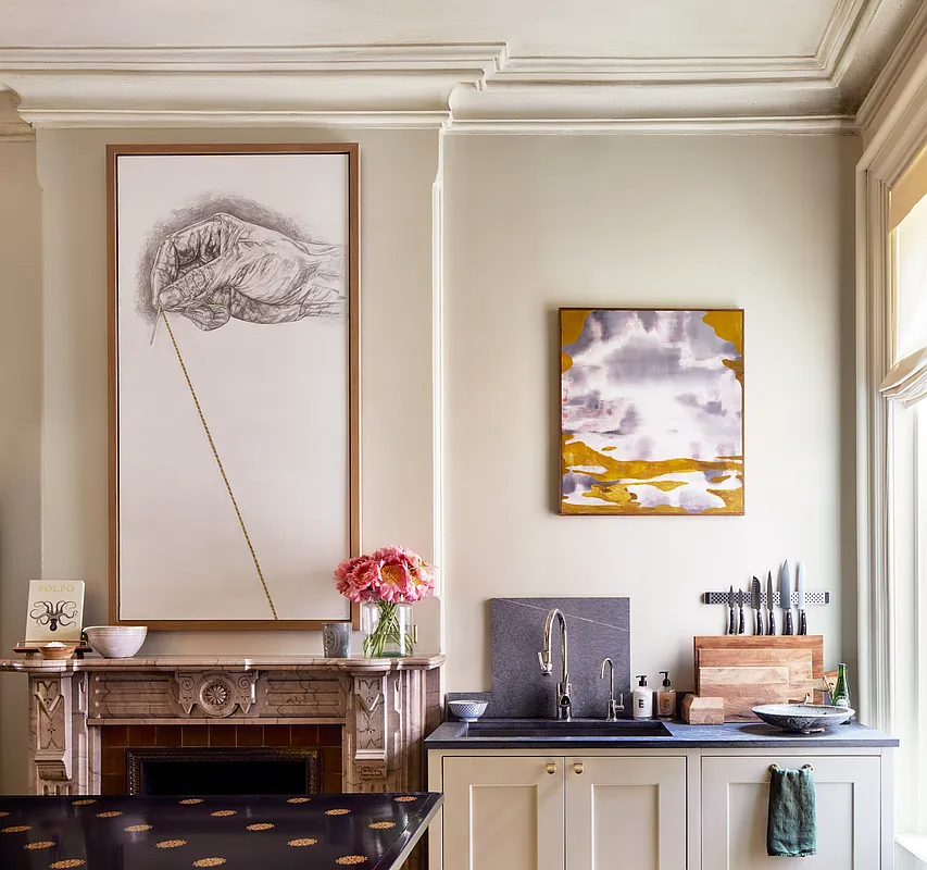 kitchen with a sink next to a marble mantel