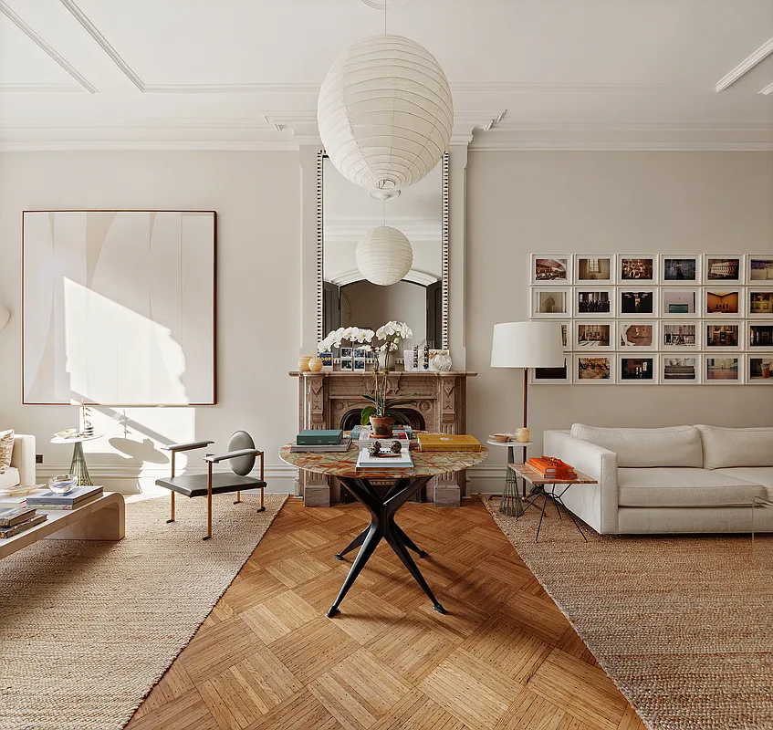 parlor with wood floor, marble mantel