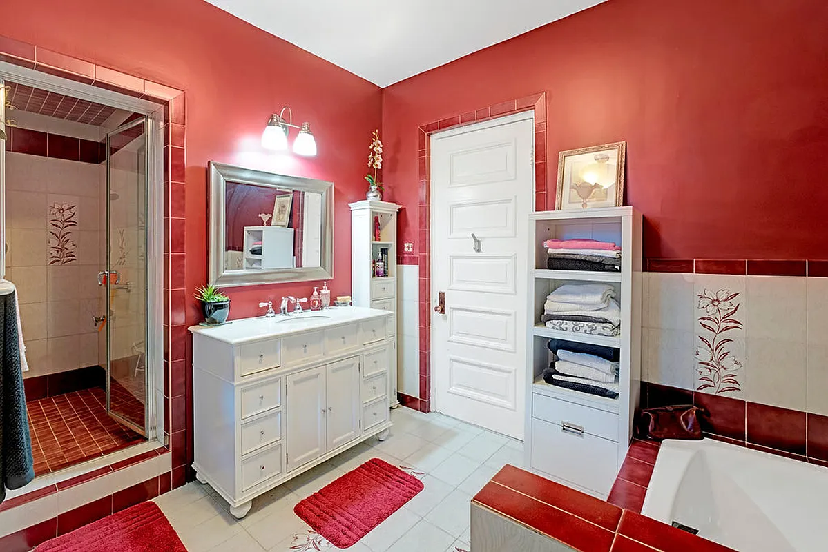 bathroom with built-in shower, red and white tile