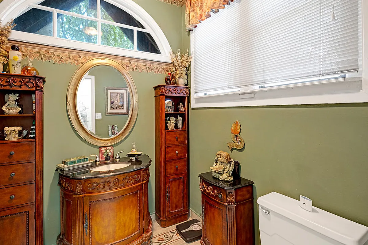 powder room on first floor with green walls