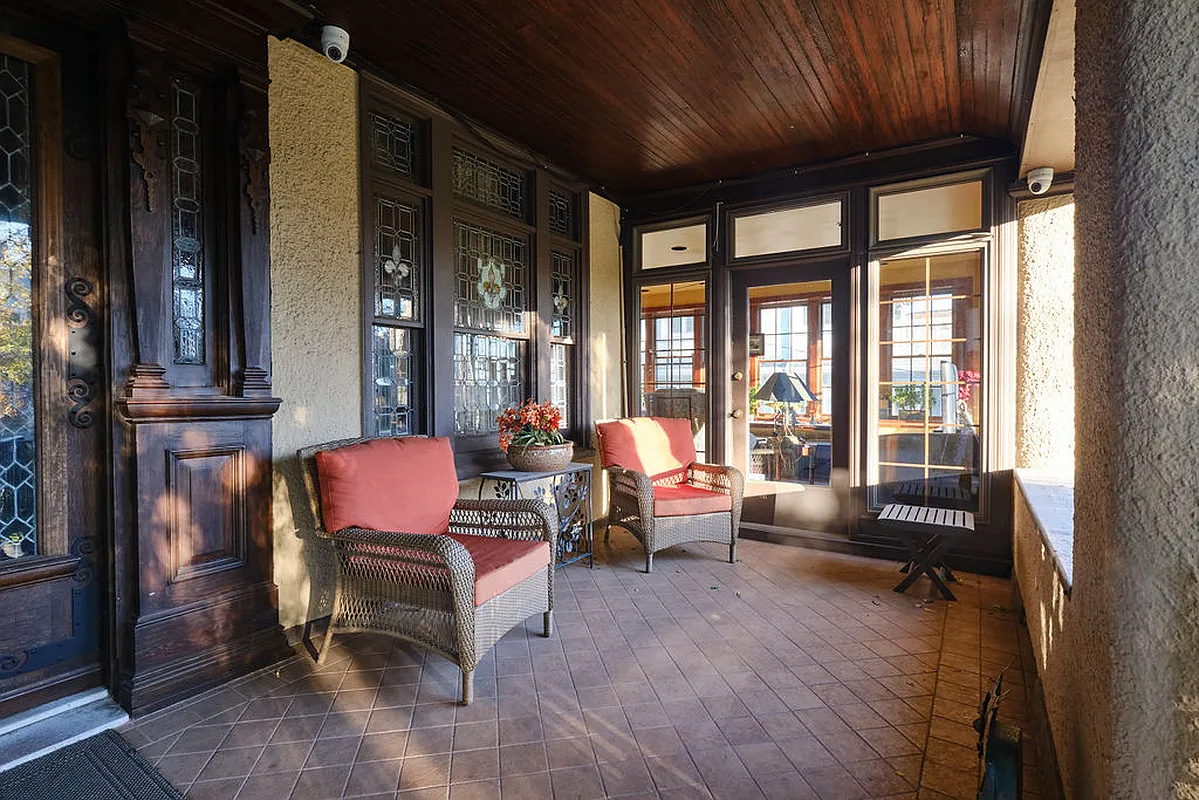 front porch with tile floor, wood ceiling and room for seating