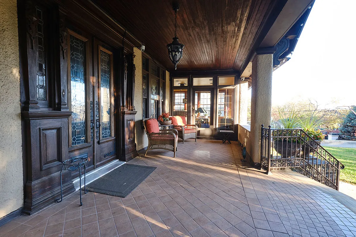 front porch with tile floor, wood ceiling and room for seating