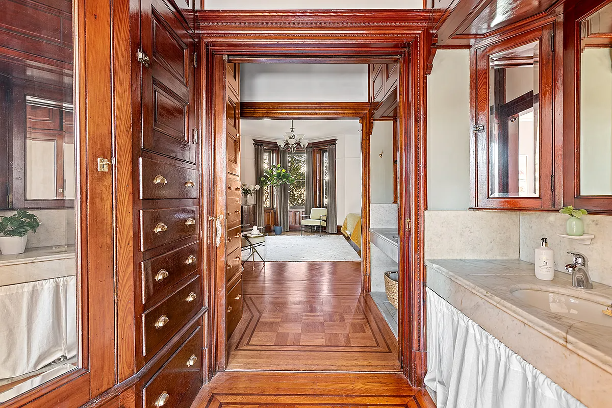 pass-through with marble sinks, built-in storage