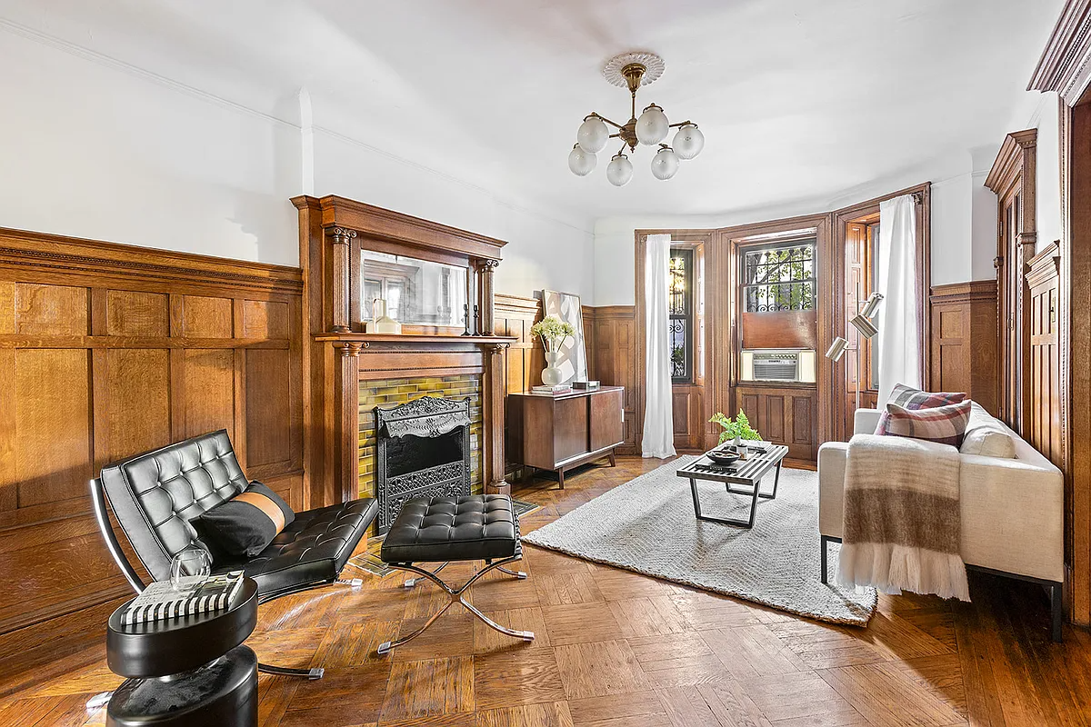 garden level dining room with wainscoting, wood mantel