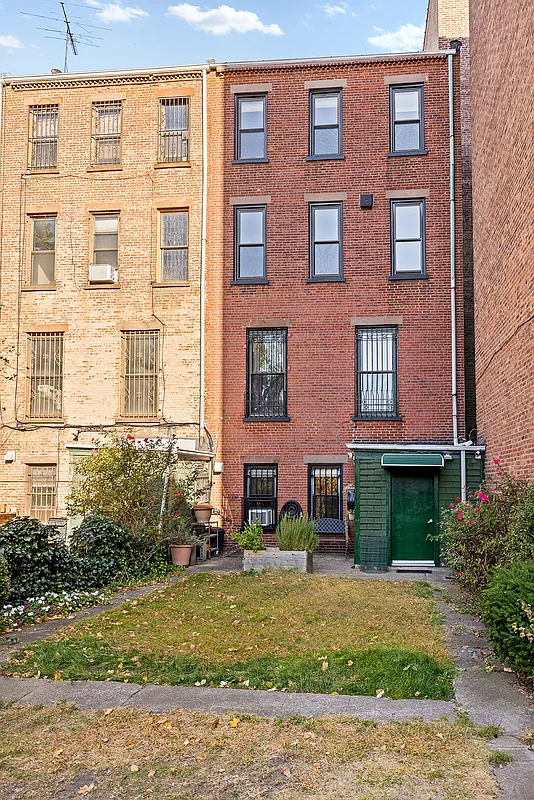 rear brick facade with unfenced yard