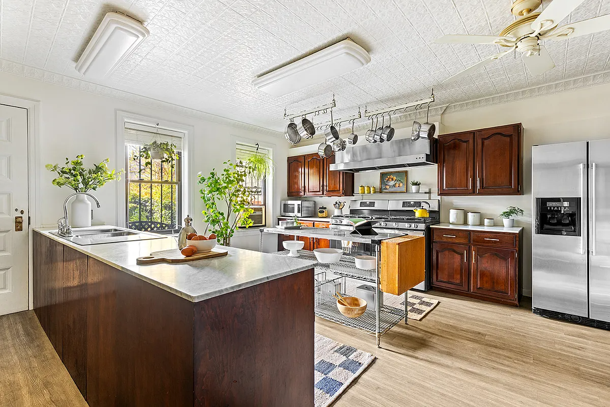 kitchen with tin ceiing, wood cabinets