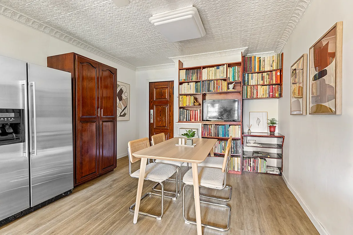 kitchen with tin ceiling, faux wood floors