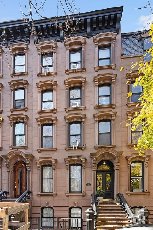 italianate brownstone exterior with ornate window surrounds