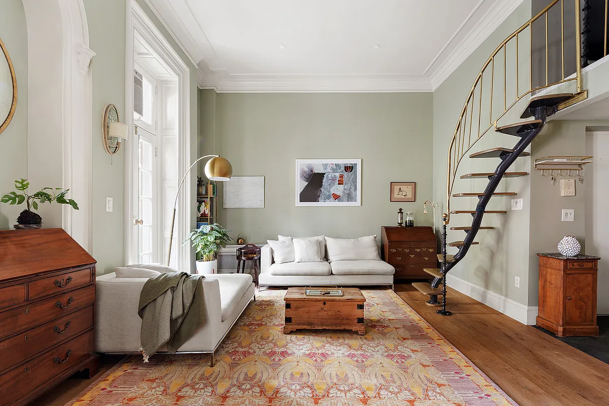 living room with view of custom, curved stair to loft