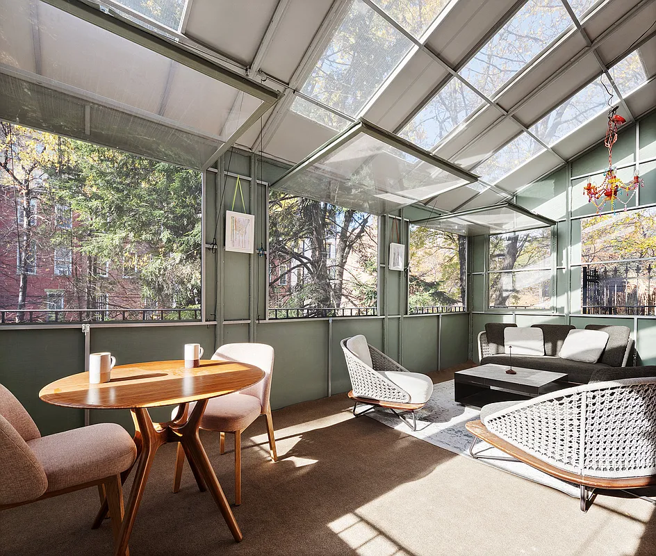 enclosed terrace with skylights, room for dining and lounging