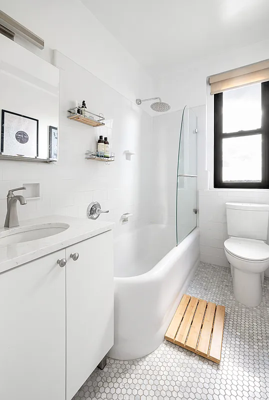 bathroom with white fixtures, hex tile floor