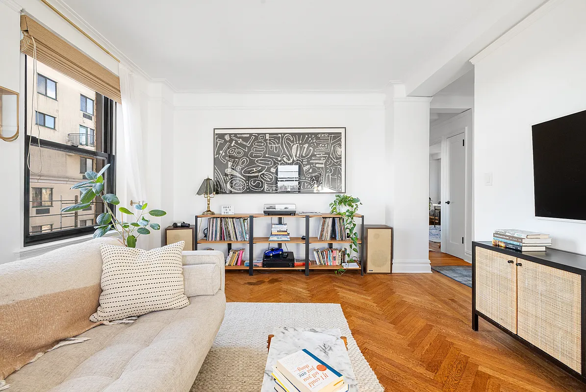 living room with wood floor, view to hall