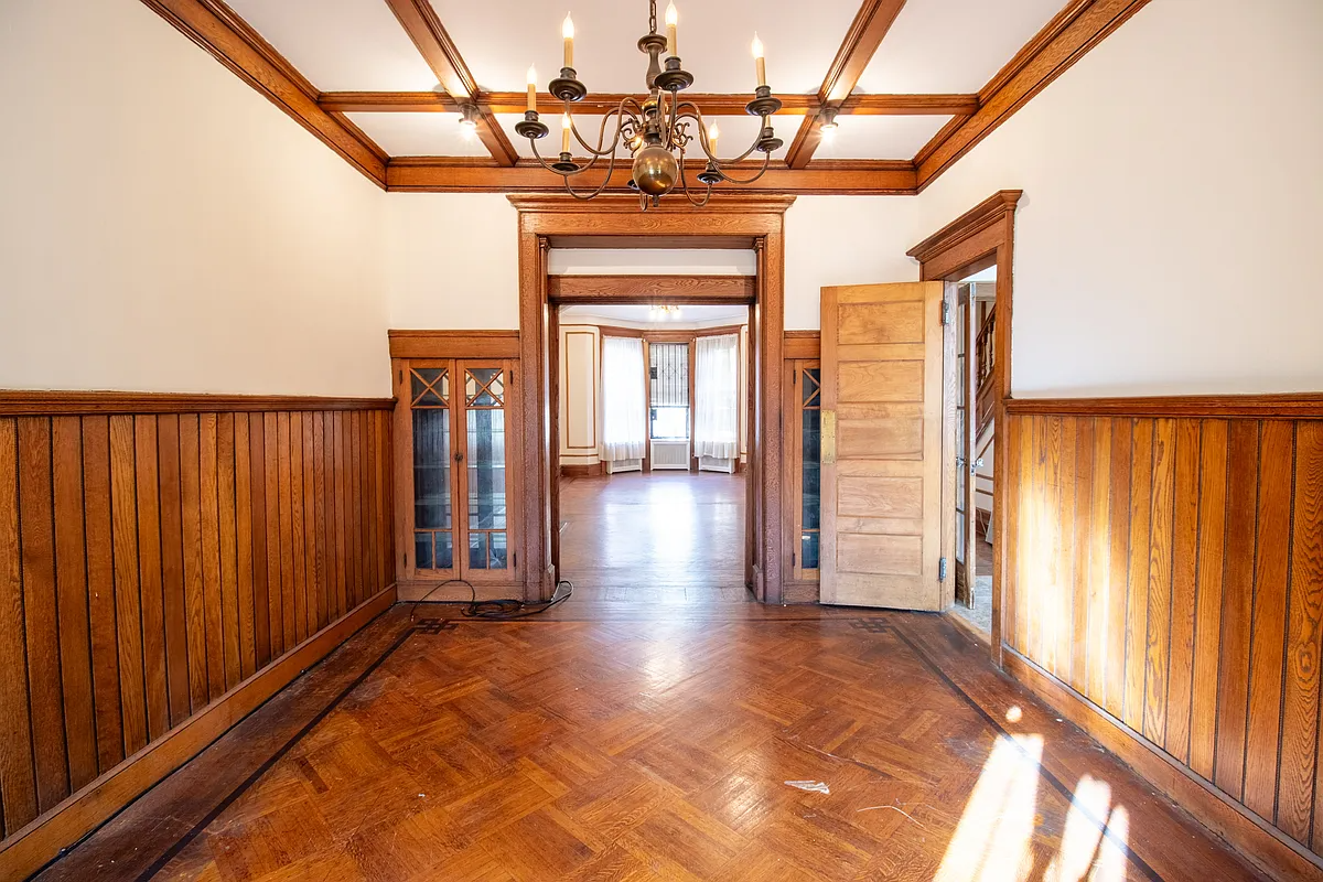 dining room with wainscoting, built-ins