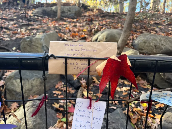 Visitors tied notes of support to the fence near the scene of the fire.